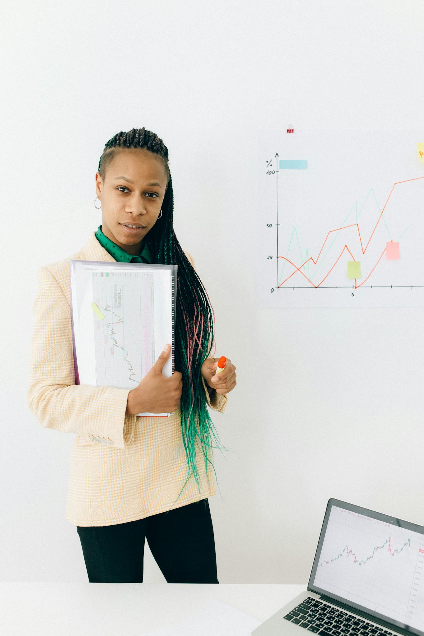 Woman in White Long Sleeve Shirt Holding White Paper